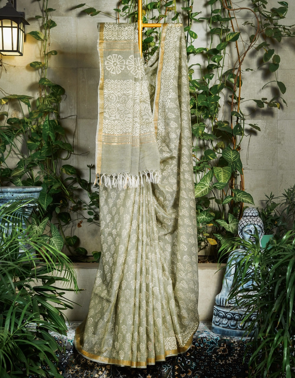 Green With White Floral Motifs And Gold Border Linen Saree