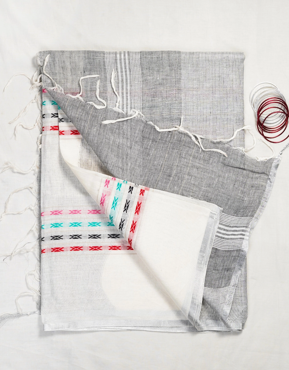 Hovered view of Off White Body With Aqua Blue Pallu And Multicolour Woven Accents Linen Saree