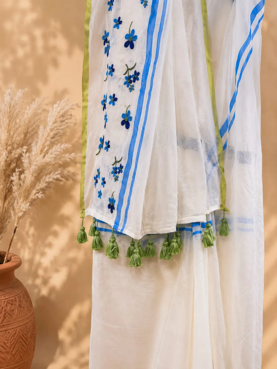 Hovered view of Multicolour Floral Embroidered Mul Cotton Saree With Blue Border & Green Tassels
