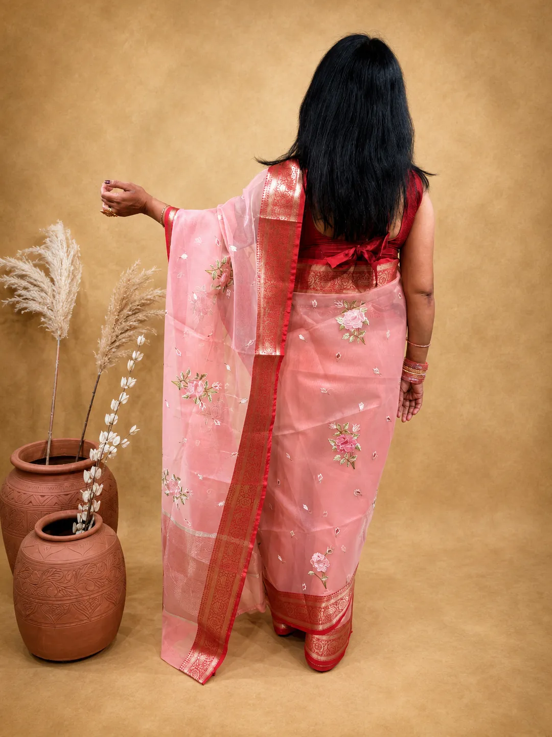 Pink Organza Blend Saree In Peach Pink With Floral Embroidery And Zari Border front view