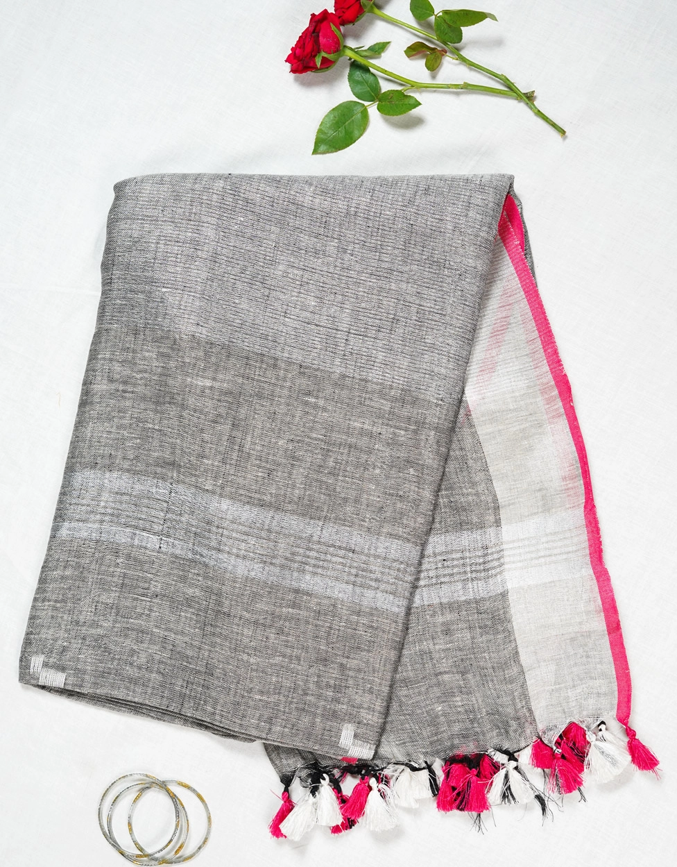 black-and-white-handwoven-linen-saree-with-pink-border-and-tassels