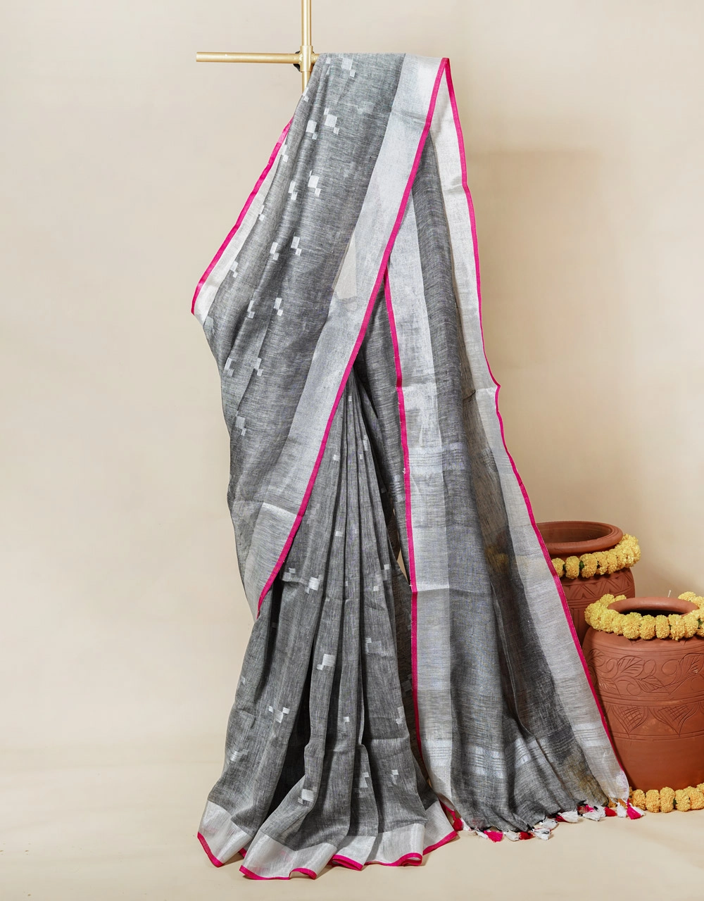 black-and-white-handwoven-linen-saree-with-pink-border-and-tassels