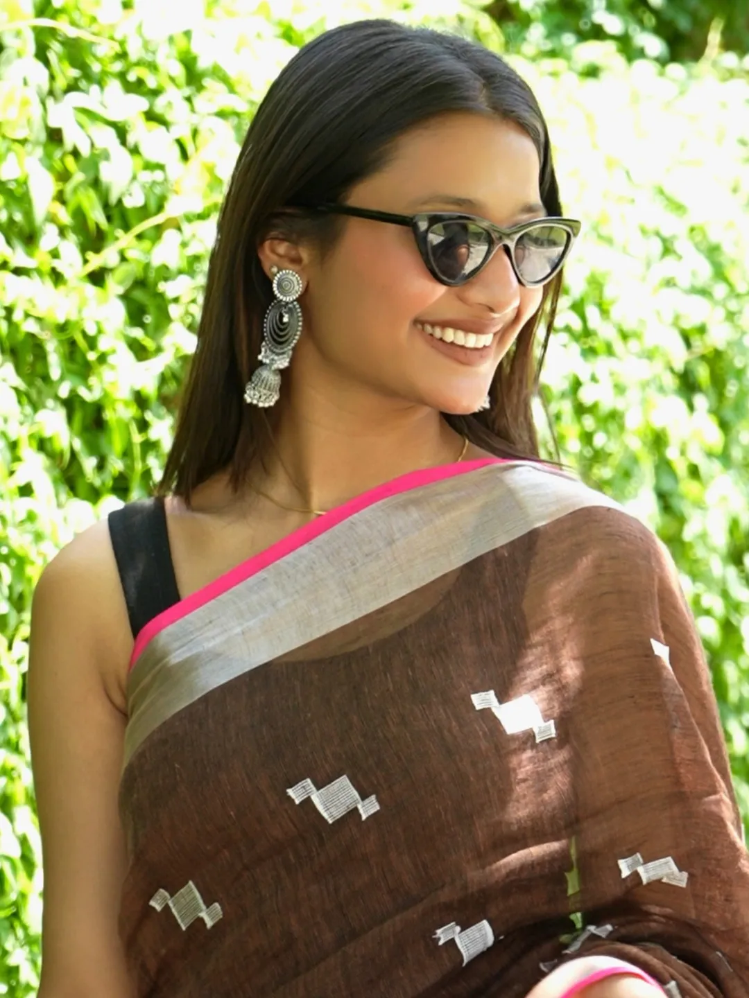 Brown Handwoven Linen Saree With Silver Zari Border And Hand Tasselled Edge front view
